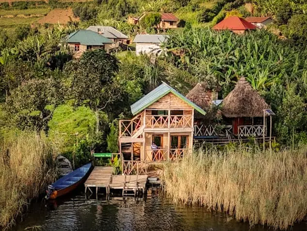 The hostel's cabins and jetty seen from the water
